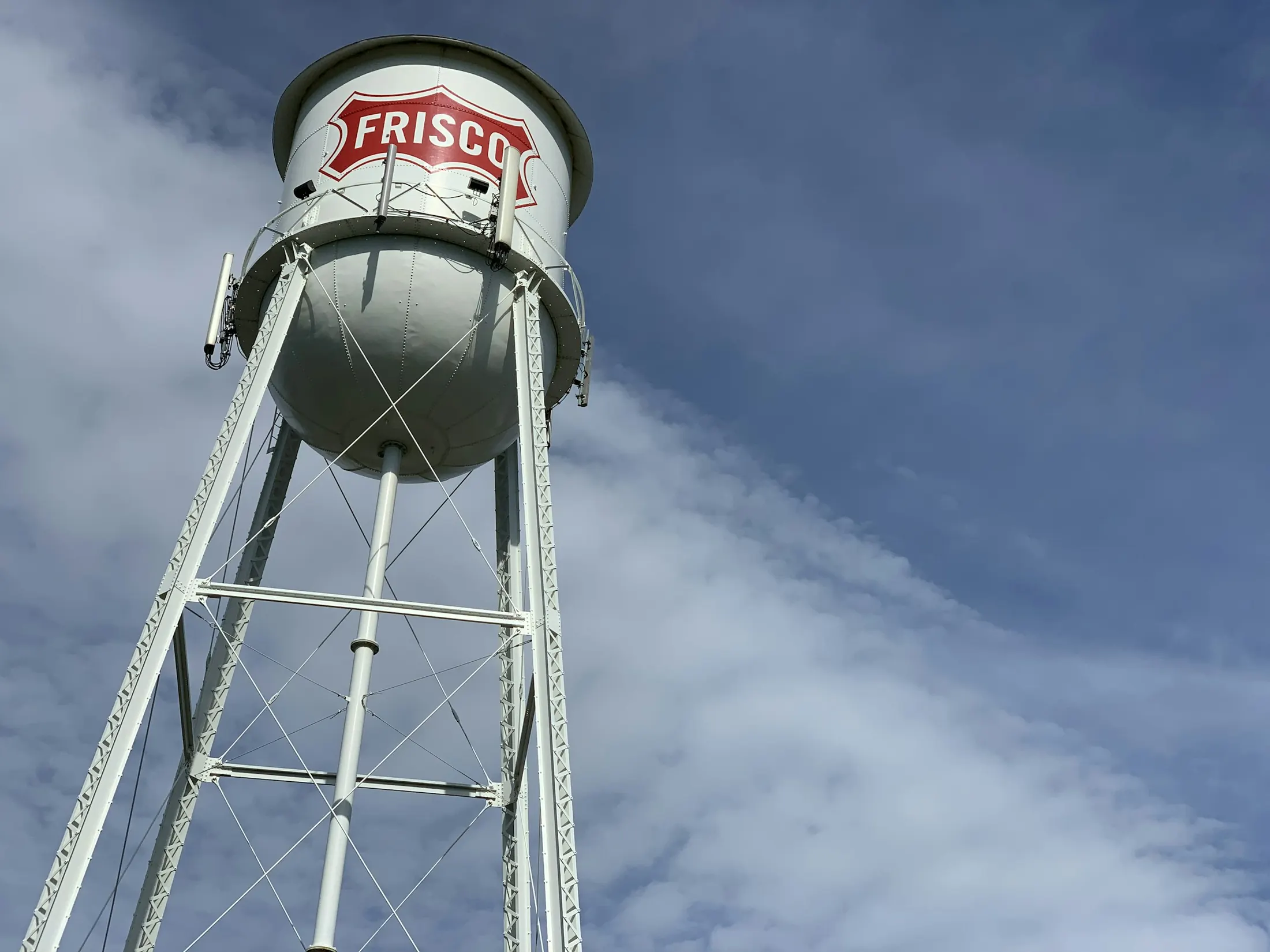 The Frisco water tower against a blue sky